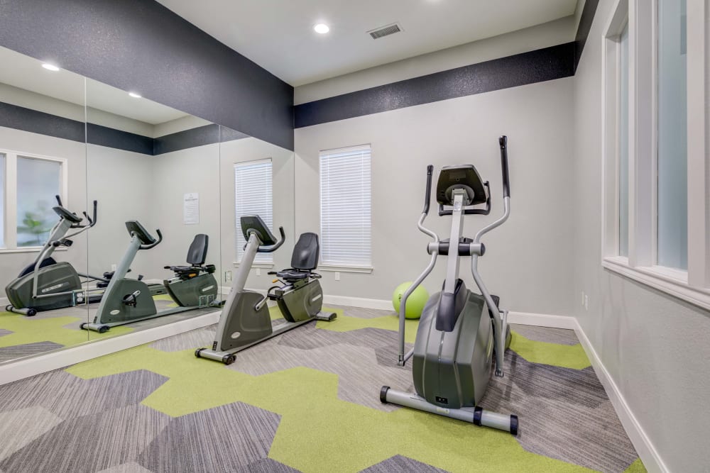 A variety of workout equipment in fitness center at Reserve at South Creek in Englewood, Colorado