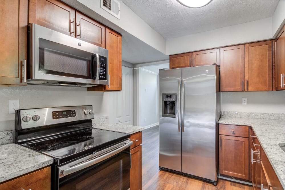 Our apartments at The Lodge on the Chattahoochee Apartments in Sandy Springs, Georgia feature kitchens with stainless steel appliance and ample cabinet and counter space.