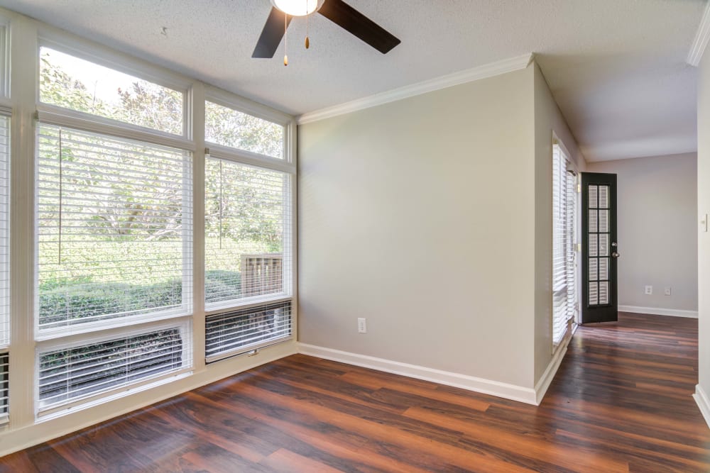 Floor to ceiling windows offer an abundant amount of natural light in an apartment at The Lodge on the Chattahoochee Apartments in Sandy Springs, Georgia