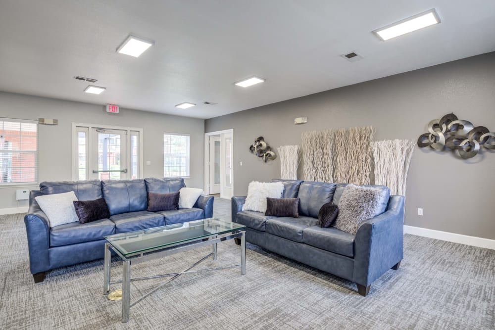 Comfortable couches inside clubhouse at Centennial East Apartments in Englewood, Colorado