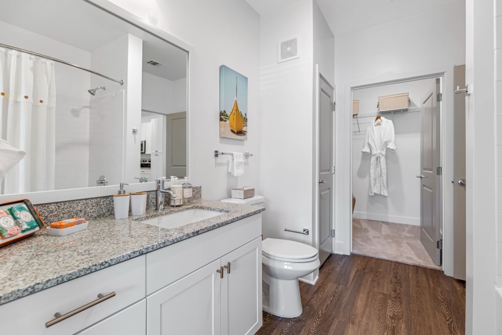 Bathroom and walk-in closet in an apartment at The Griffon Vero Beach in Vero Beach, Florida 