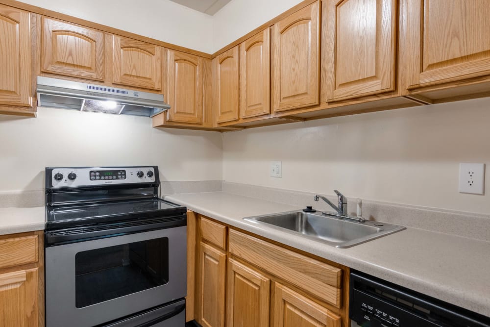 Kitchen featuring with cabinets and ample counter space at Parkway Apartments in Williamsburg, Virginia