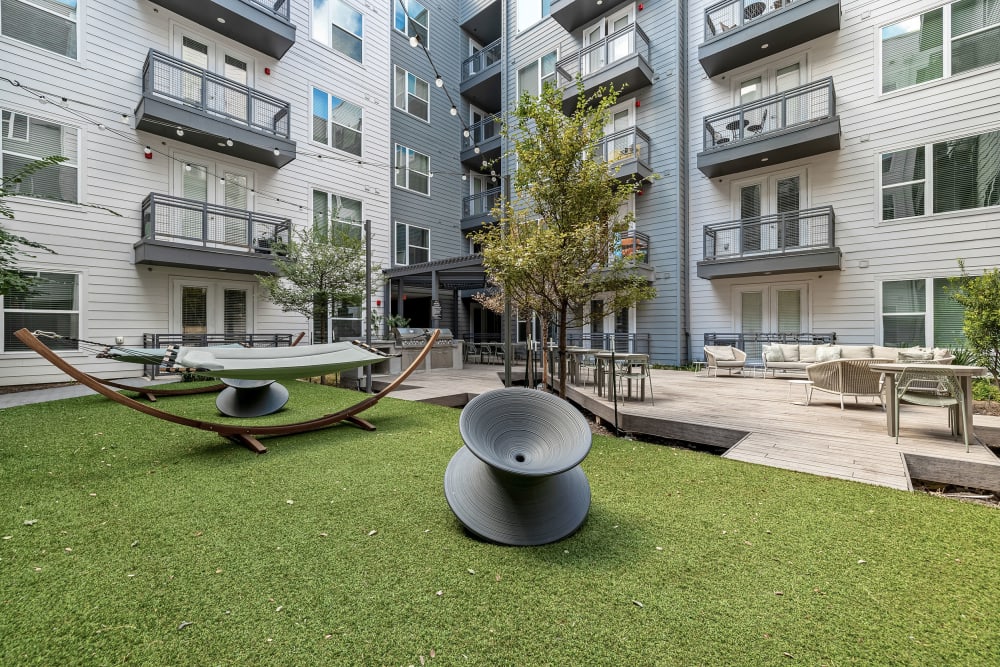 Exterior courtyard area with hammocks at 44 South in Austin, Texas