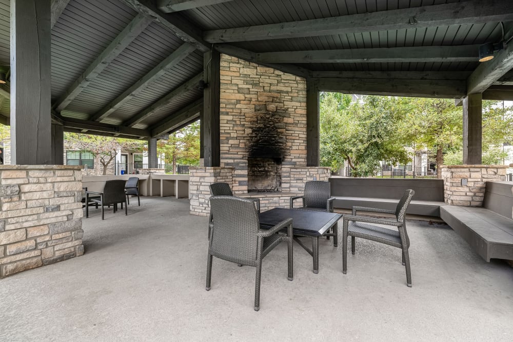 Community seating and fireplace next to the pool at Marquis on Lakeline in Cedar Park, Texas