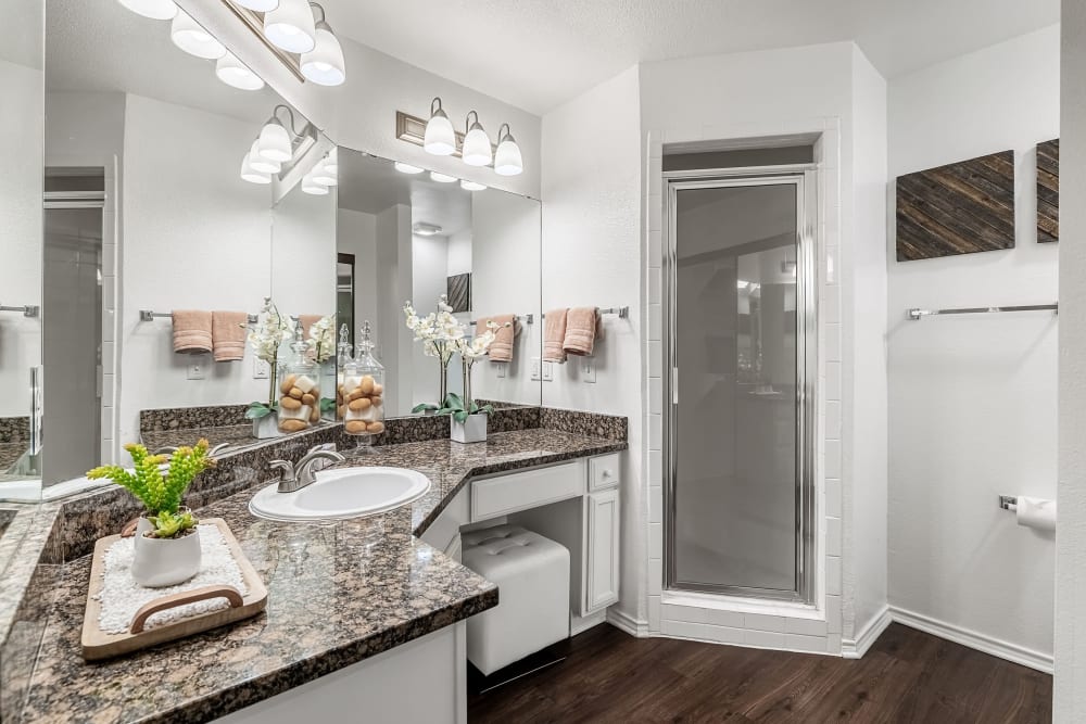 Large vanity with white cabinets at Marquis at Caprock Canyon in Austin, Texas