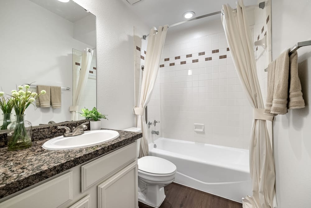 Large vanity with white cabinets at Marquis at Caprock Canyon in Austin, Texas
