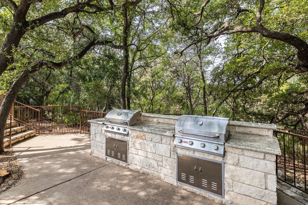 Grills by the pool at Marquis at Caprock Canyon in Austin, Texas