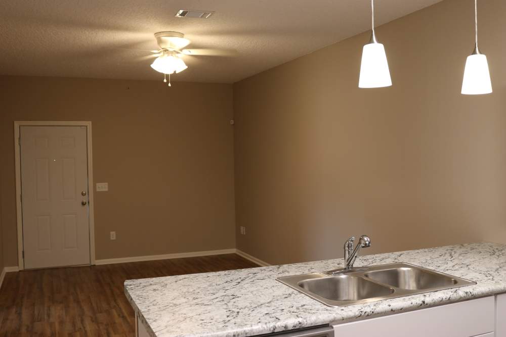 Kitchen and living area at Patriots Place in Valdosta, Georgia