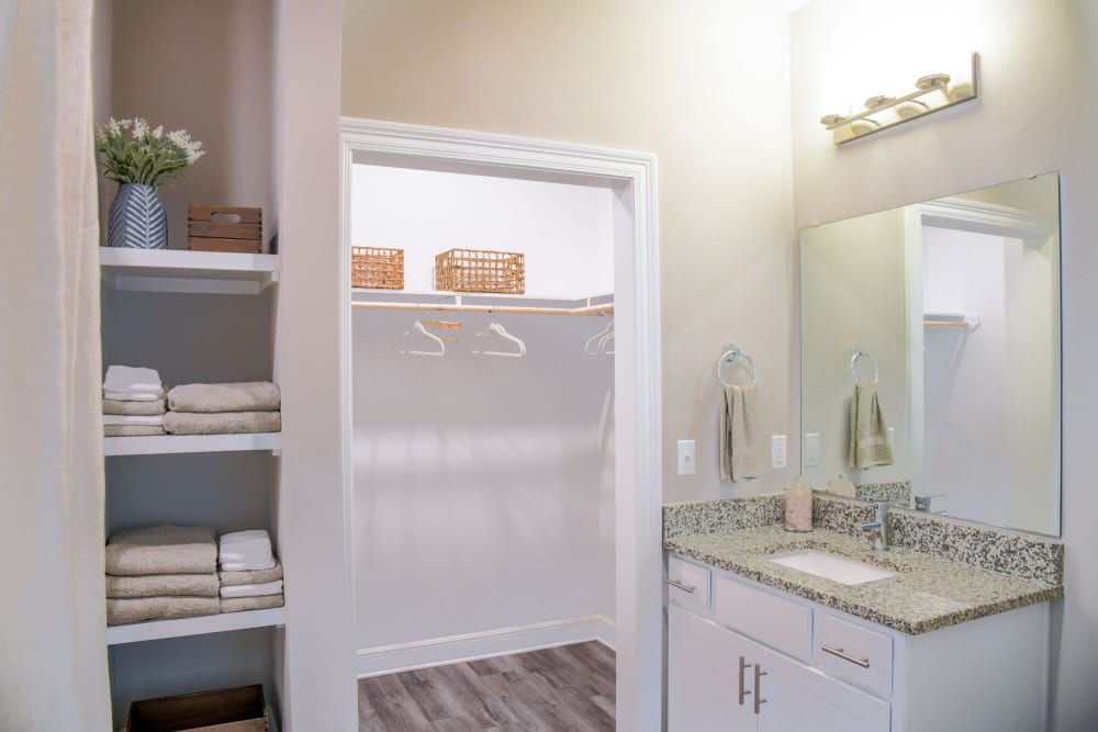 Model bathroom with shelving at The Waters at Ransley in Pensacola, Florida