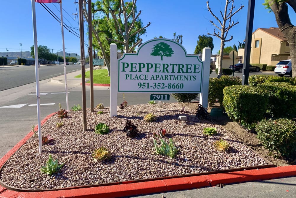 Outdoor sign at Peppertree Place Apartments in Riverside, California