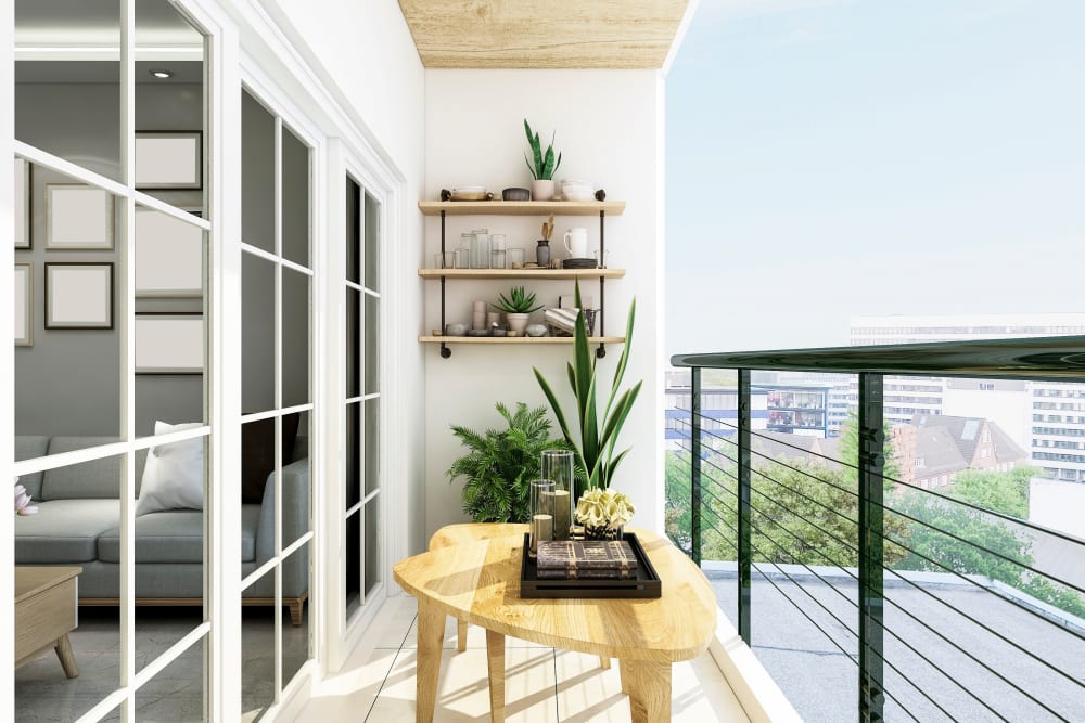 Well-decorated private balcony outside an upper-floor apartment with an incredible view of the city at Slauson Village in Culver City, California