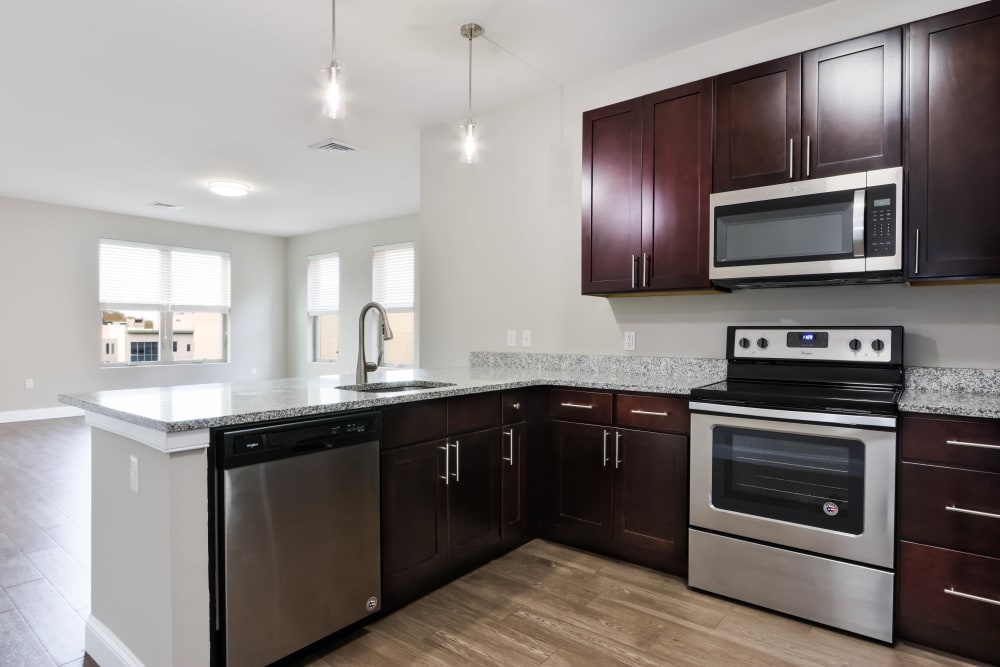 Spacious kitchen with modern appliances in a model home at Five 10 Flats in Bethlehem, Pennsylvania
