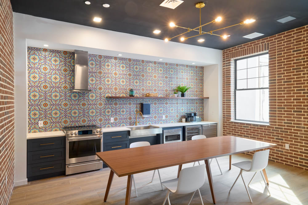 Communal kitchen with table and oven at The Seville Apartments in Easton, Pennsylvania
