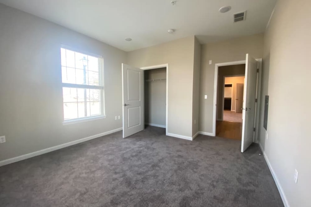 Large bedroom and closet in an unfurnished model home at Pearl Pointe Apartments in Burlington, New Jersey