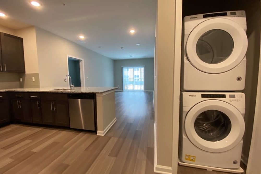 In-home washer and dryer units adjacent to the kitchen in a model home at Pearl Pointe Apartments in Burlington, New Jersey
