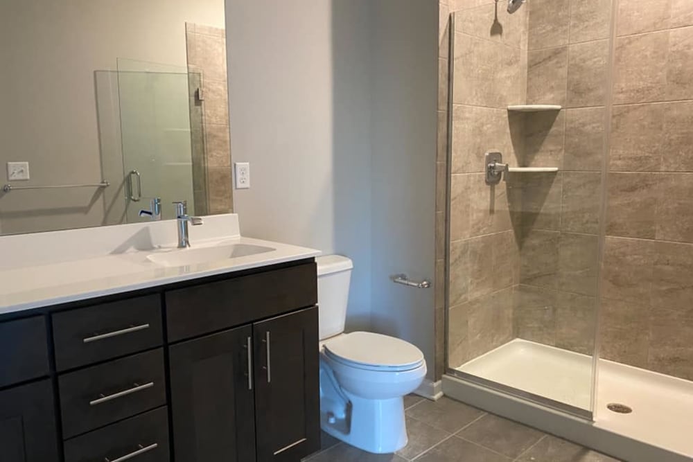 Luxurious bathroom with walk-in shower at Pearl Pointe Apartments in Burlington, New Jersey