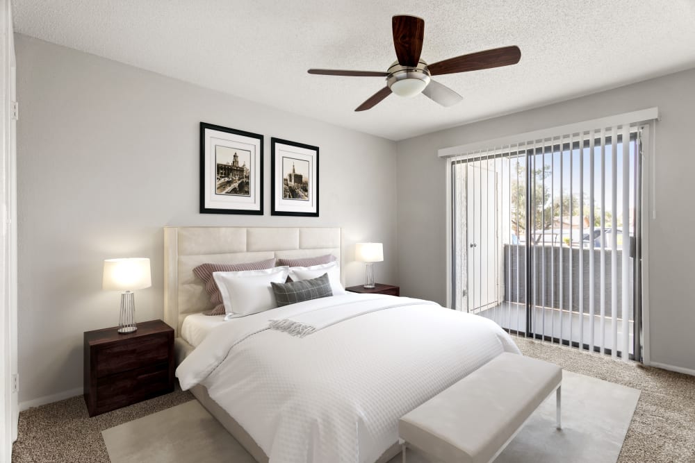 Bedroom with doors to private balcony at Cielo on Gilbert in Mesa, Arizona