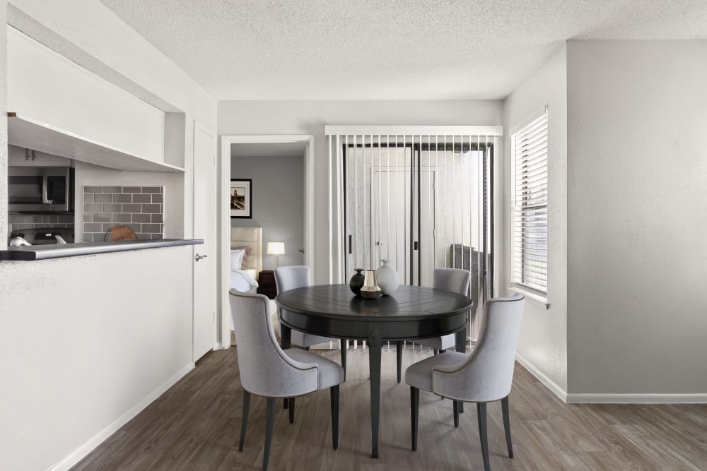 Dining table on wood-style flooring at Cielo on Gilbert in Mesa, Arizona