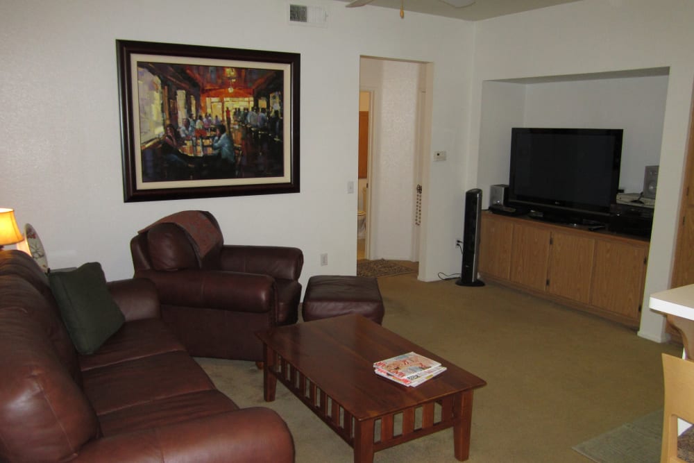 Model living space with TV at Villas on the Green in Palm Desert, California