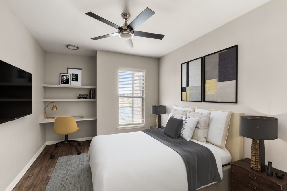 Bedroom with personal TV at Olympus Las Colinas in Irving, Texas