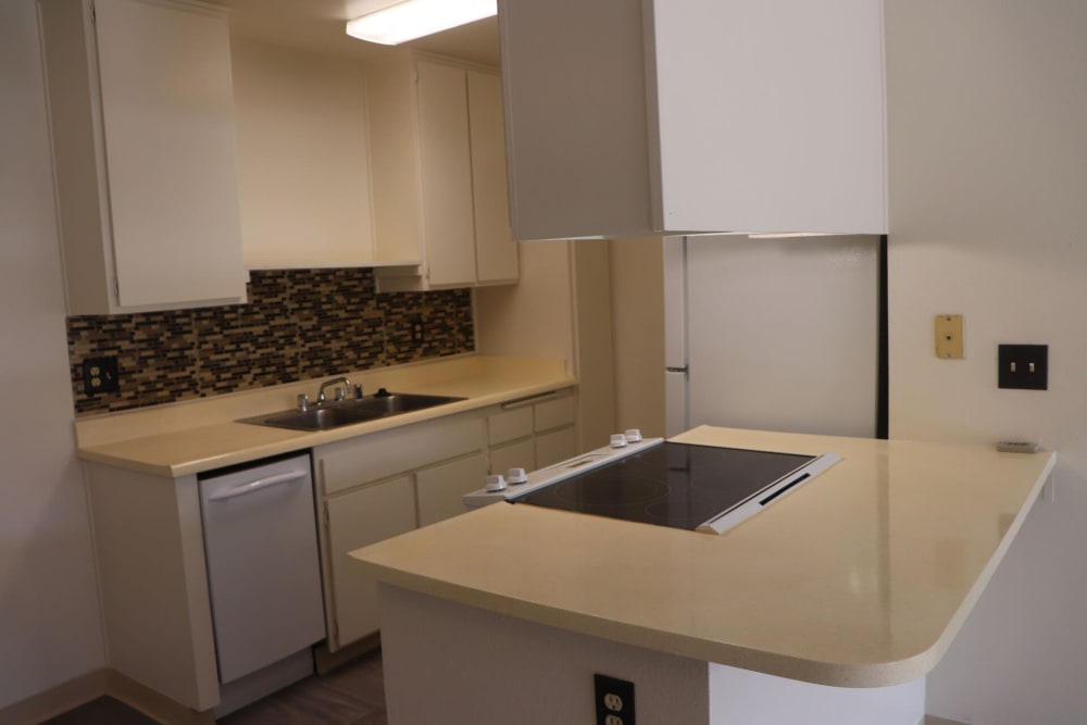 Kitchen with cabinets at Gramercy Apartments in San Diego, California