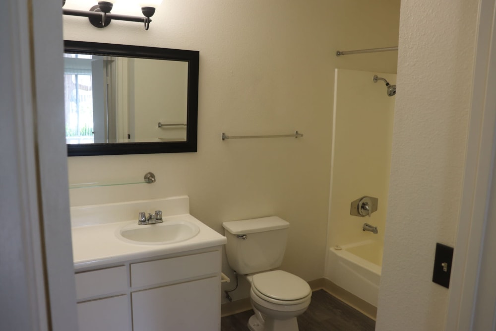 Bathroom with mirror at Gramercy Apartments in San Diego, California