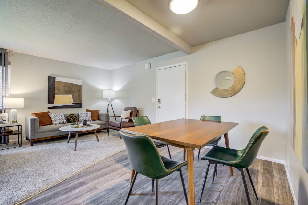 Dining space and living room at Cherry Creek Apartments in Riverdale, Utah