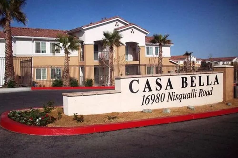Exterior of an apartment with sign at Casa Bella in Victorville, California