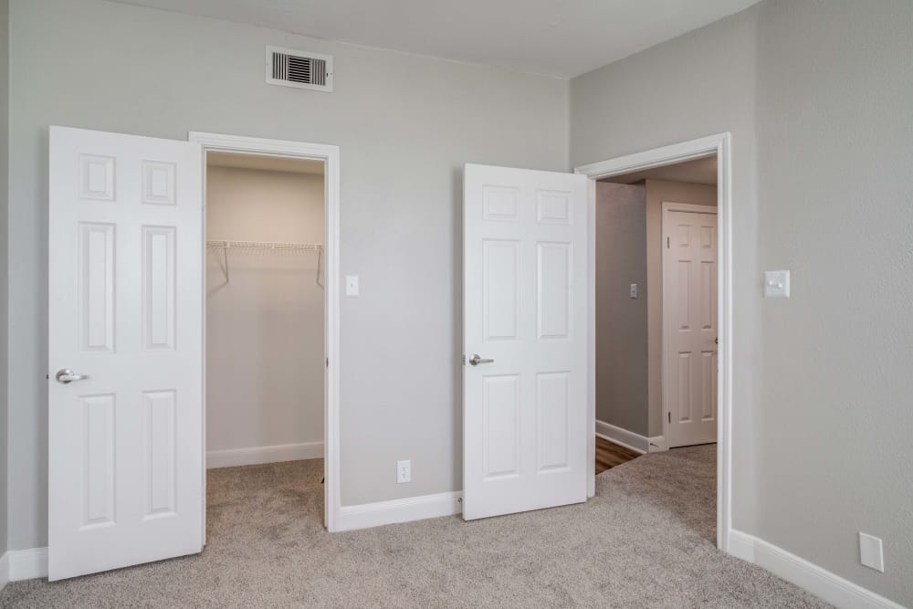 Bedroom entrance and closet in an Apartment at Signature Point Apartments in League City, Texas