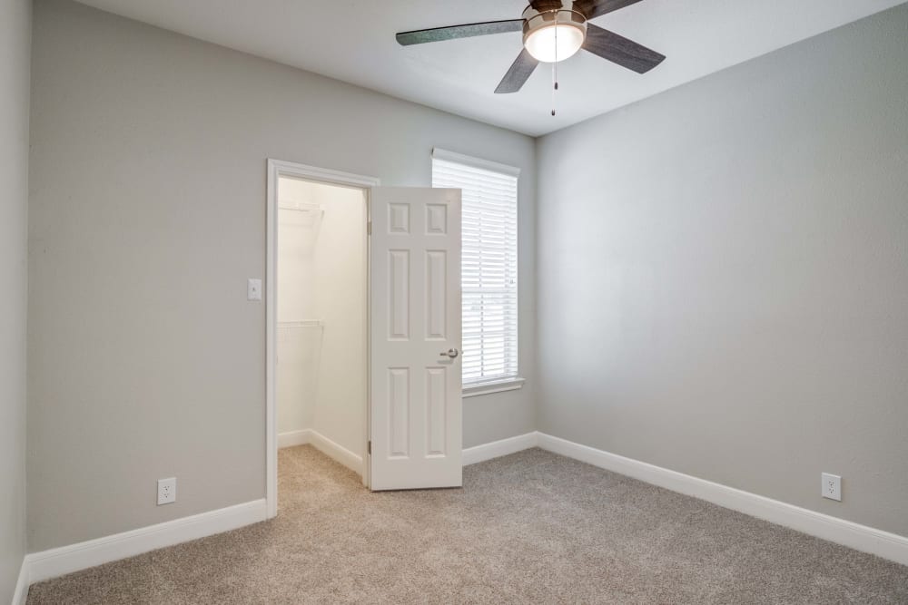 Bedroom featuring a ceiling fan at Signature Point Apartments in League City, Texas