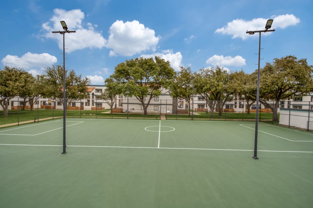 Tennis courts plus at Mateo Apartment Homes in Arlington, Texas