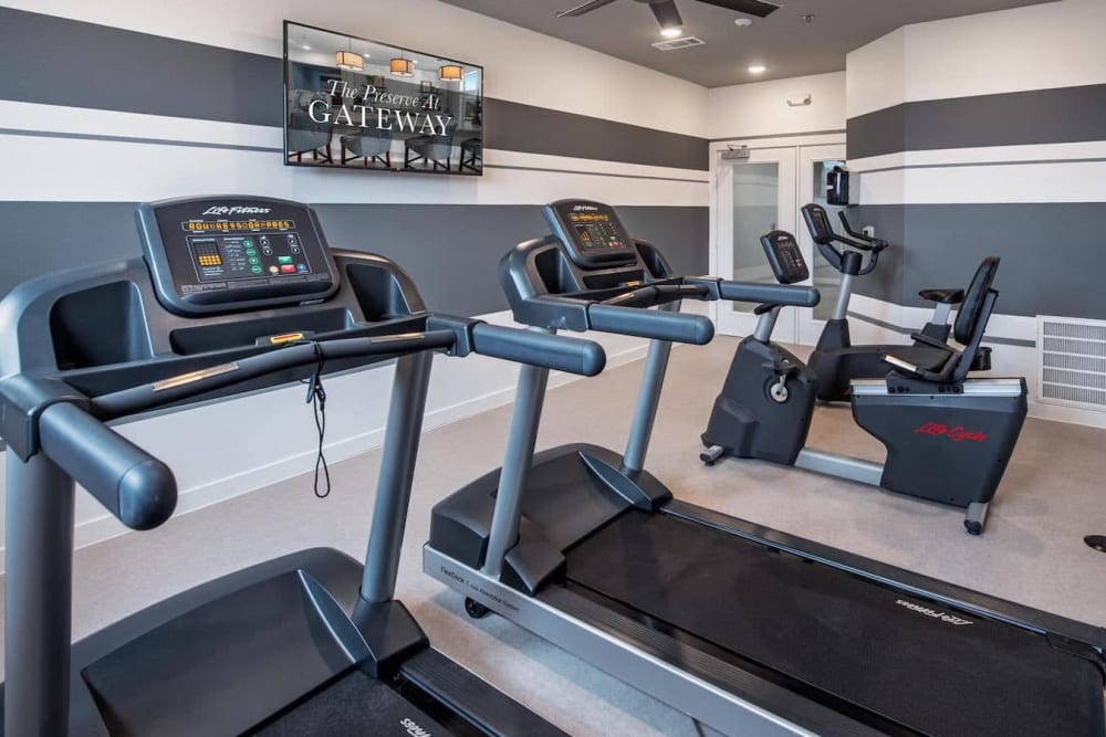 Fitness center with treadmills at The Preserve at Gateway in Forney, Texas