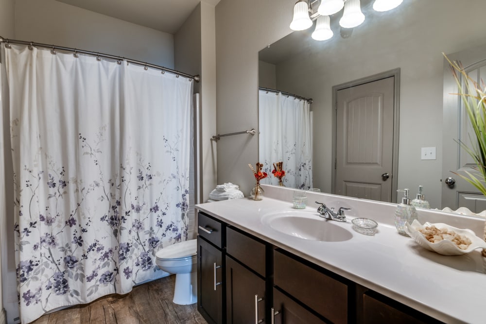 Bathroom with nice counters at Remi Apartment Homes in White Settlement, Texas
