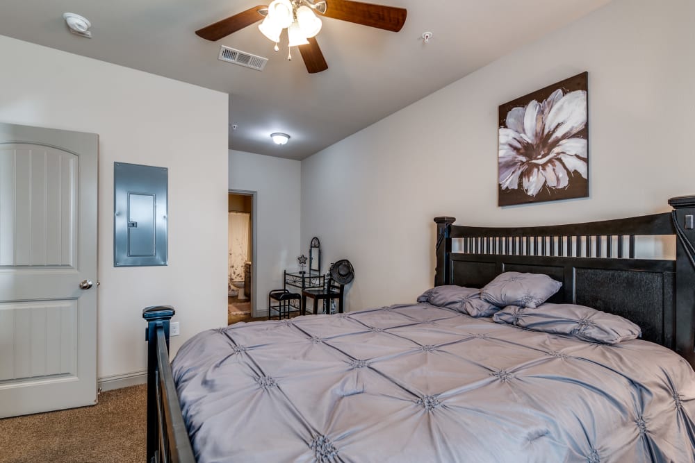 Bedroom with modern details at Remi Apartment Homes in White Settlement, Texas