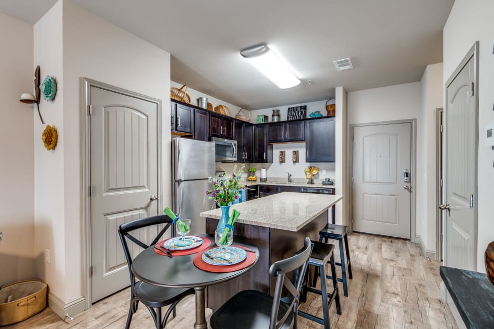 Kitchen with quality counters at Remi Apartment Homes in White Settlement, Texas