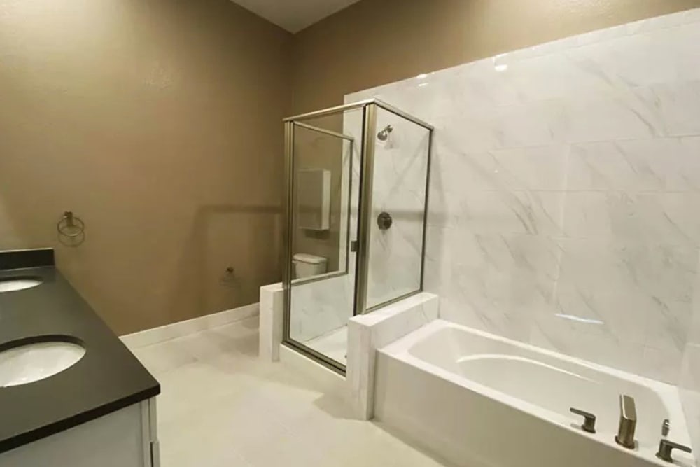Bathroom with bath and shower at The Deco at Victorian Square in Sparks, Nevada