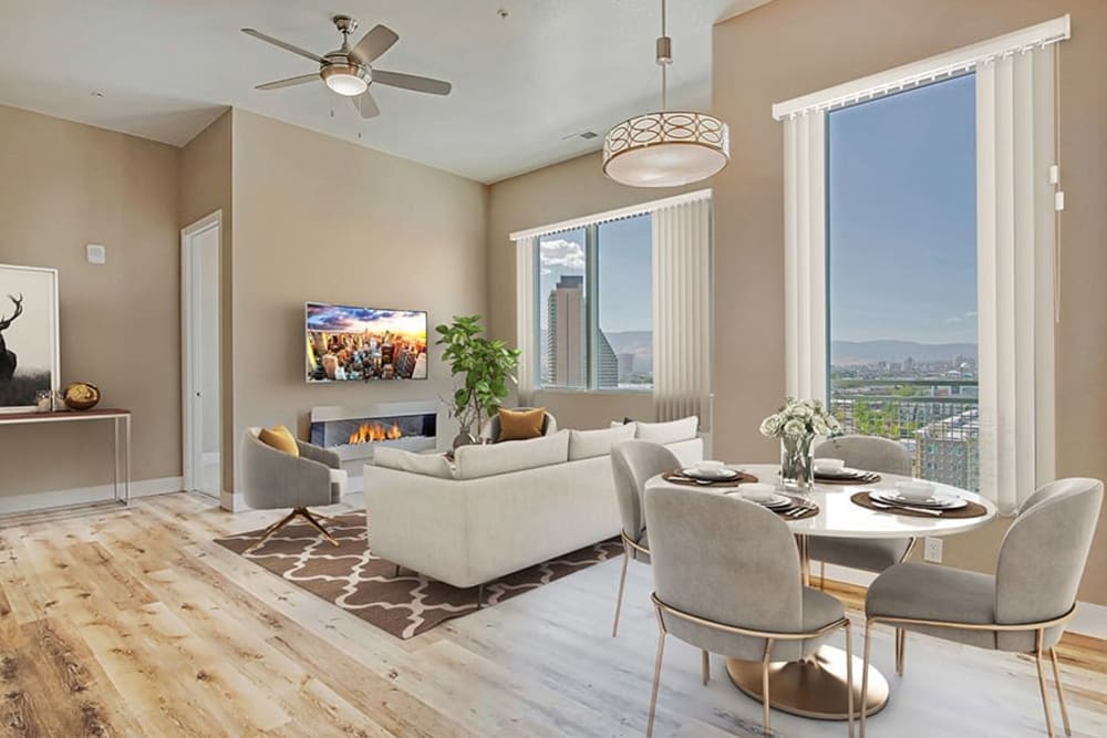 Living room with large windows and a beautiful view at The Deco at Victorian Square in Sparks, Nevada