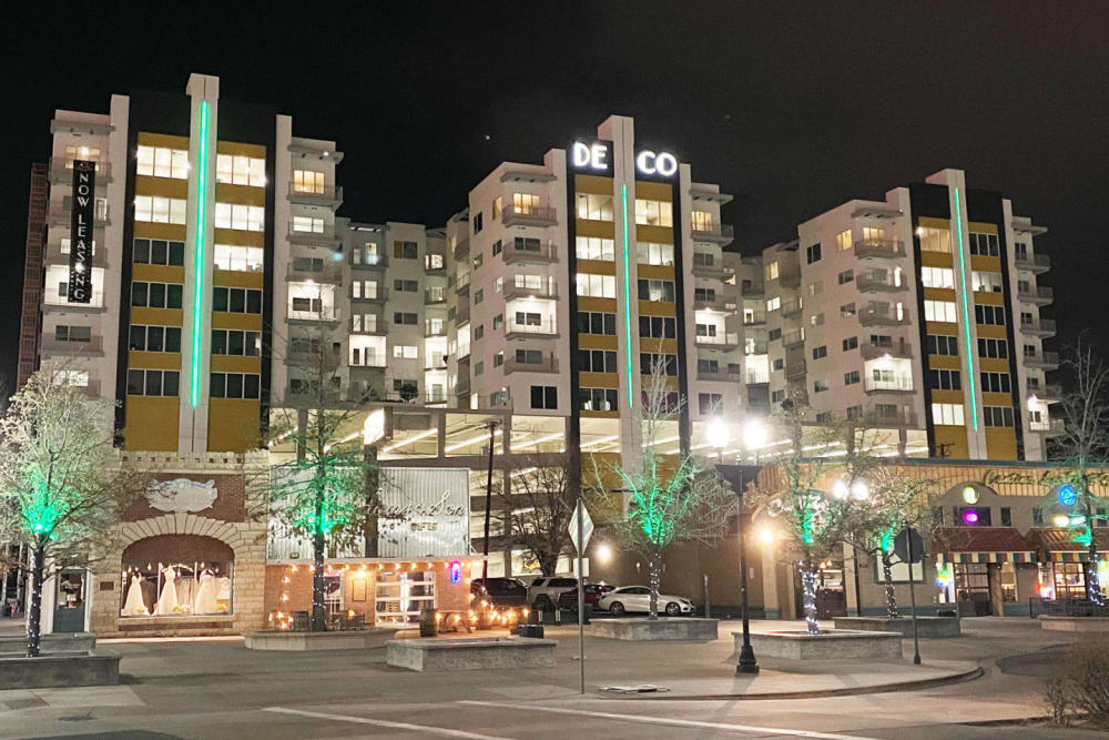 The building lit up at night at The Deco at Victorian Square in Sparks, Nevada