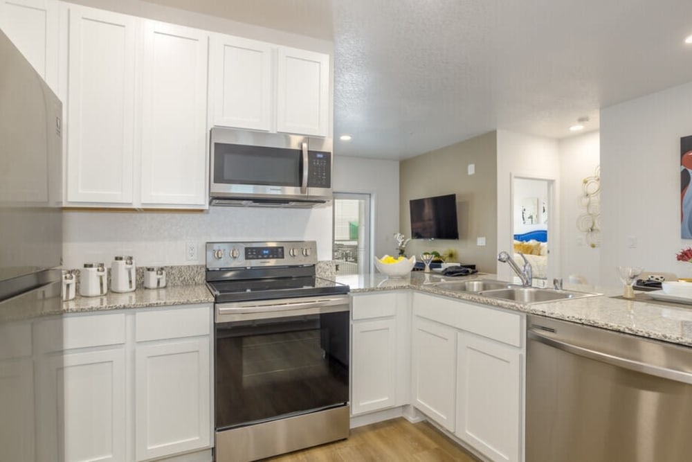 Kitchen with stainless-steel appliances at The Deco at Victorian Square in Sparks, Nevada