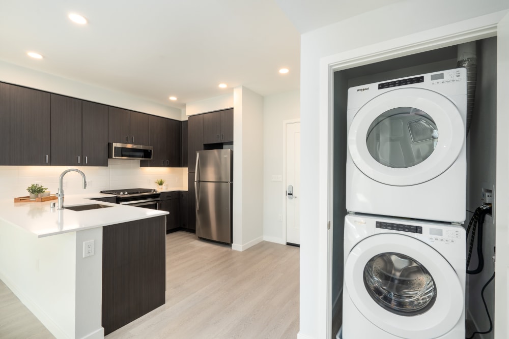 Chef-inspired kitchen and stacked in-home washer and dryer at MV Apartments in Mountain View, California