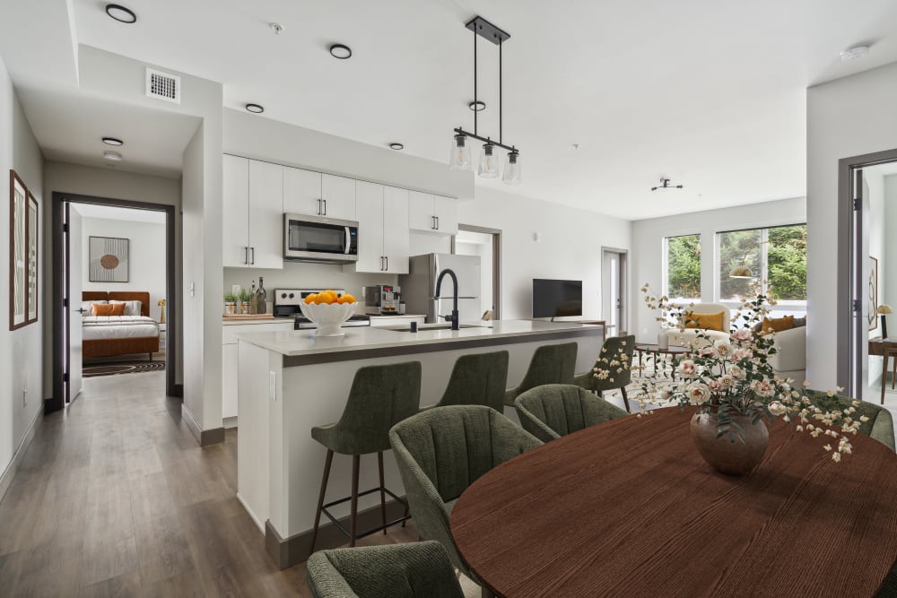 Kitchen with white counters and breakfast bar at Alta Crossing in Marysville, Washington