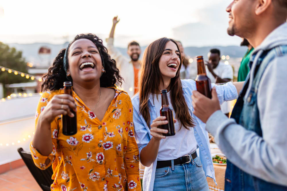 A group of friends having drinks together near Lattitude34 Greenville in Greenville, South Carolina