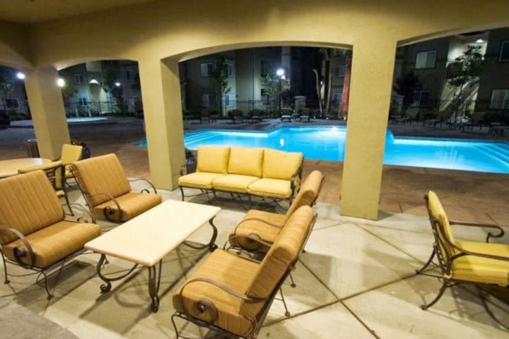 Outdoor lounge by the pool at Villas At Villaggio in Modesto, California