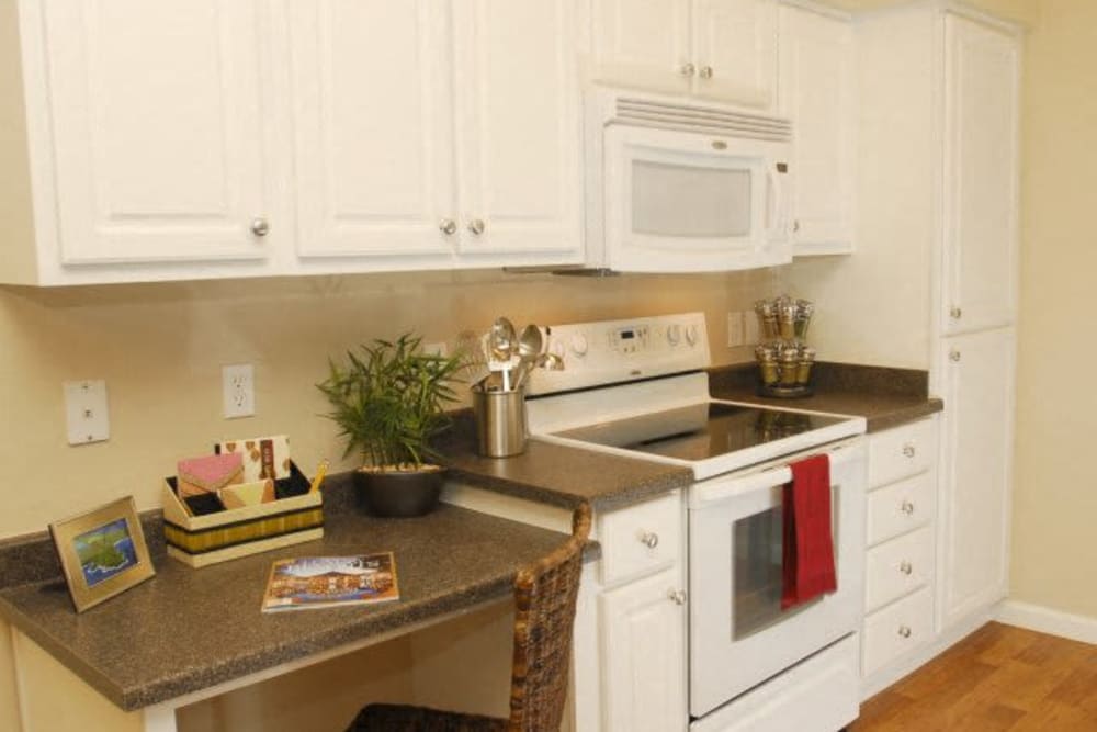 Kitchen with white appliances at Villas At Villaggio in Modesto, California