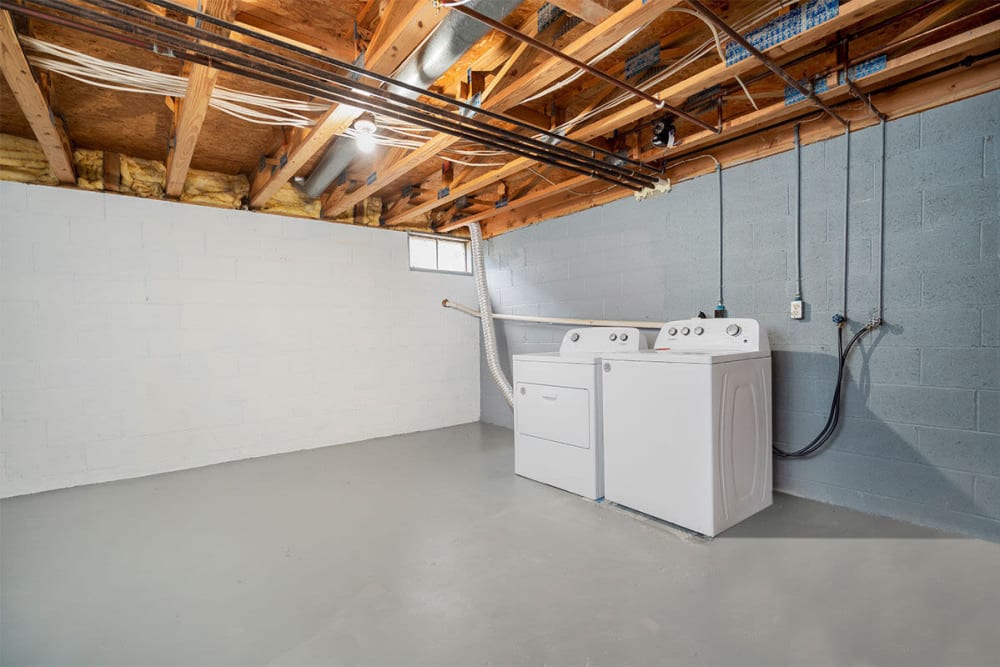 Basement area with washer and dryer at Mason Row Townhomes in Dublin, Ohio 