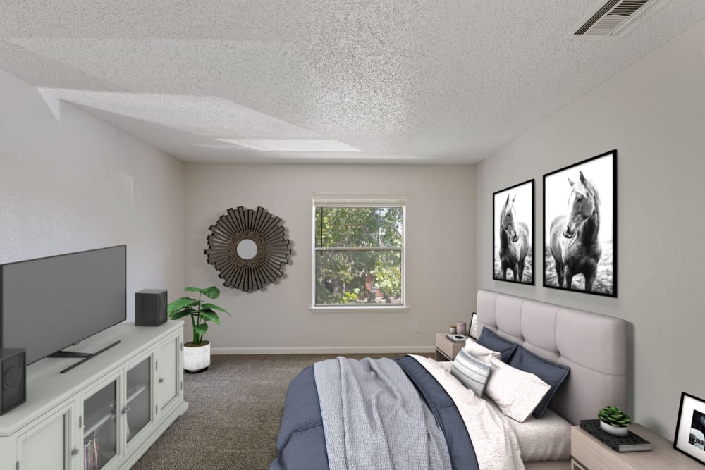 Modern bedroom with a bed and dresser at Pinewood Estates in Albuquerque, New Mexico