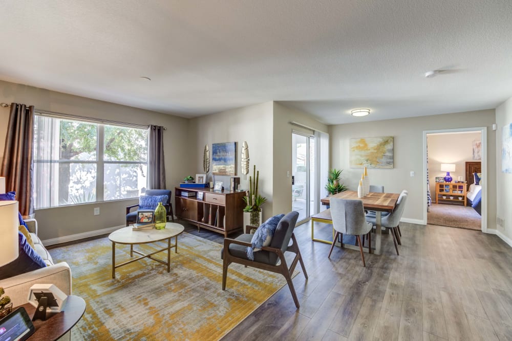 Living room and dining space in an apartment at Ascent at Silverado in Las Vegas, Nevada