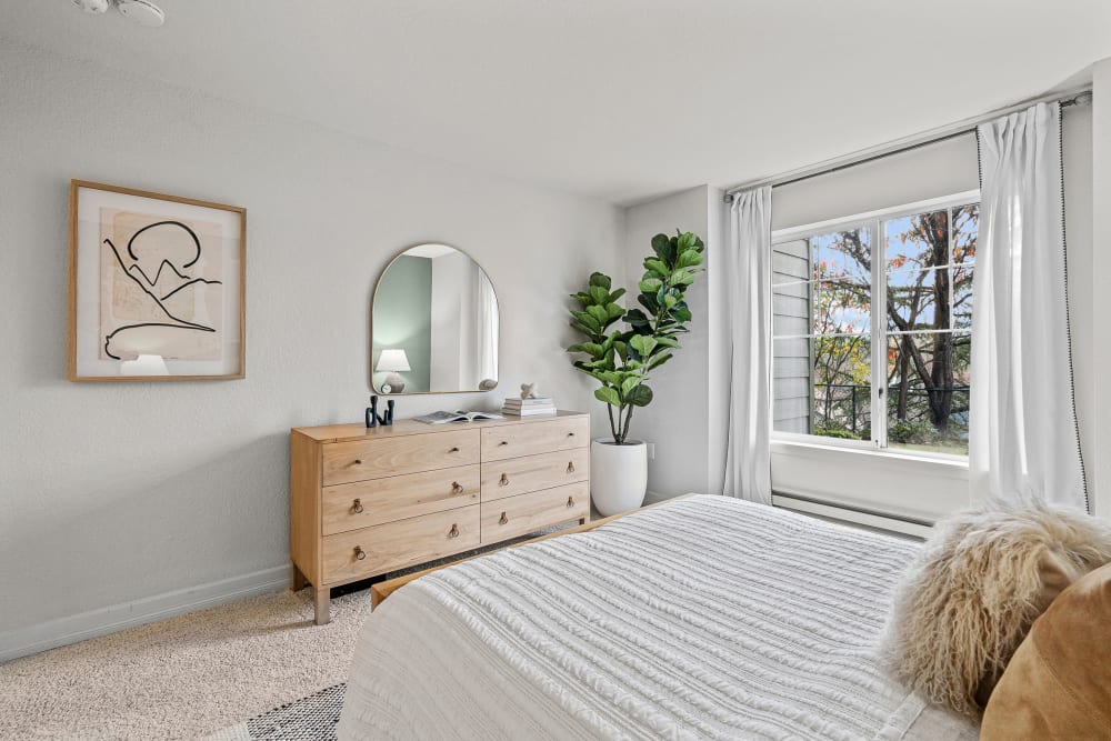 Large and comfortable bedroom with large amounts of natural light at Timbers at Tualatin in Tualatin, Oregon
