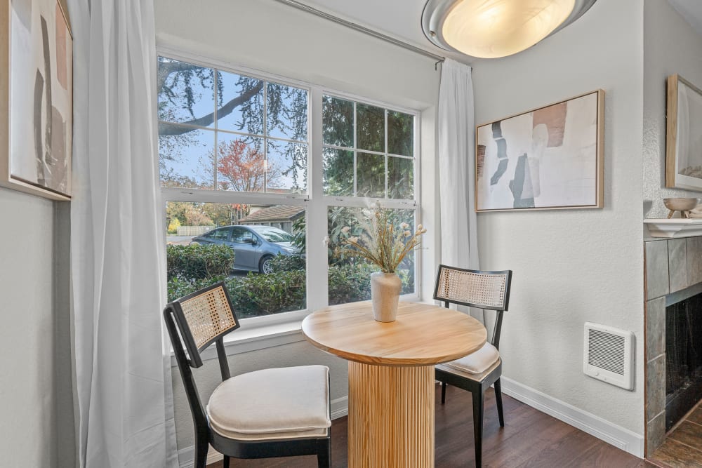 Bright dining room with large windows at Timbers at Tualatin in Tualatin, Oregon