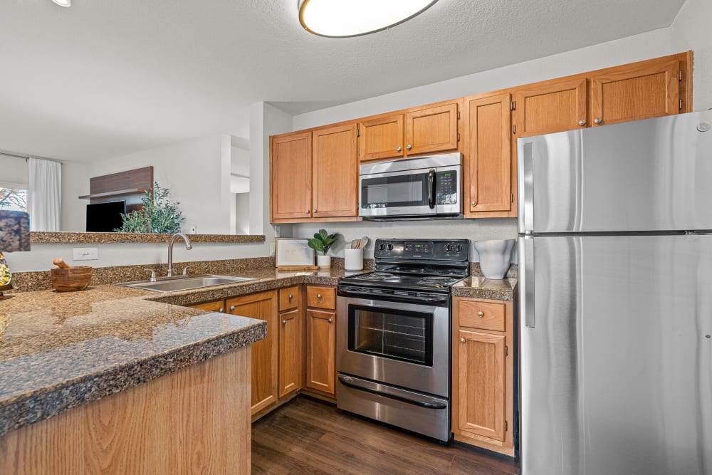 Large and modern kitchen with stainless steel appliances at Timbers at Tualatin in Tualatin, Oregon